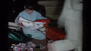 Catskill New York USA (1959): Boy Wearing Blue Pajamas Inspects Red And White