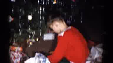 Catskill New York USA (1959): Child Opening Present Near Decorated Christmas Tree