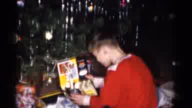 Catskill New York USA (1959): Children Receive And Uncover Christmas Gifts By The