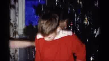 Catskill New York USA (1959): Woman Wearing Blue Shirt Holds Baby While Pointing