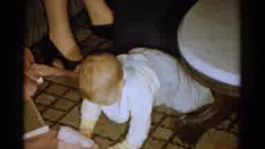 Catskill New York USA (1959): Baby Wearing All White Attempts To Crawl Around