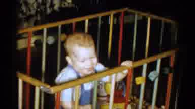 Catskill New York USA (1959): Toddler Laughing And Having Fun With Toys Inside Of