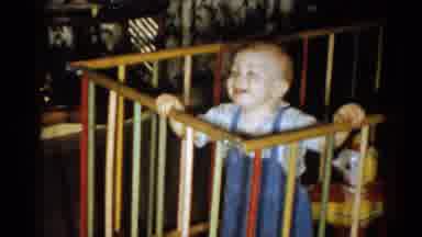 Catskill New York USA (1959): Laughing Toddler Standing And Moving About A Playpen