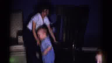 Catskill New York USA (1959): Child And Sibling Running Around Room Laughing With