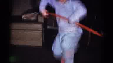 Catskill New York USA (1959): Child Hula Hoops Living Room Toddler Walks Brush
