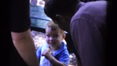 Catskill New York USA (1959): Toddler Wearing Blue Shirt Eats Ice Cream Cone At