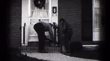 Hagerstown Maryland USA (1959): Fixing The Flower That Seems To Have Been Knocked