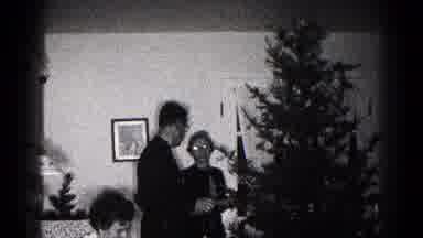 Hagerstown Maryland USA (1959): Couple Decorating The Christmas Tree While Having