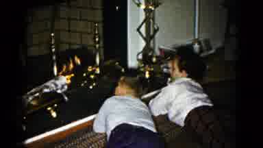 Hagerstown Maryland USA (1959): A Child And His Father Warming Up By The Fire In
