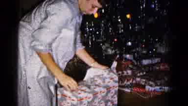 Hagerstown Maryland USA (1959): Unwrapping A Fragile Christmas Gift On Christmas
