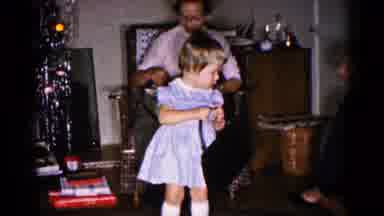 Hagerstown Maryland USA (1959): Toddler Plays With Black Purse As Mother And