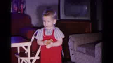 Hagerstown Maryland USA (1959): Young Boy In Red Overalls Playing With Box In