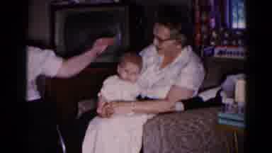 Hagerstown Maryland USA (1959): Home With Grandma Sitting Holding Baby In White