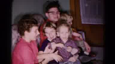 Hagerstown Maryland USA (1959): Mom Makes Goofy Faces At Kids While Cooking In The