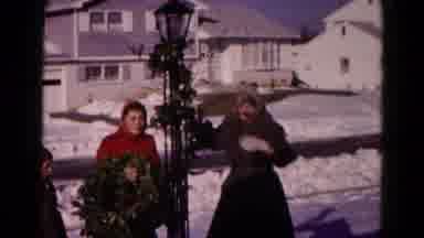 Who needs flowers when you have women decorating streetlights?