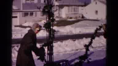 Hagerstown Maryland USA (1959): Two People Decorate With Garlands For Christmas