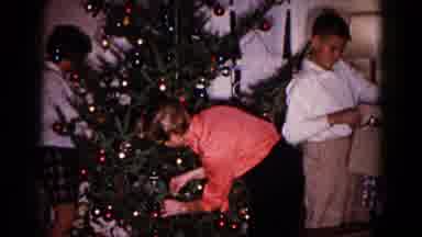 Hagerstown Maryland USA (1959): Kids Placing Ornaments And Tinsel On Green