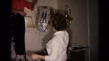 Hagerstown Maryland USA (1959): Woman Wearing White Shirt Hands Tree Tinsel To