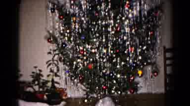 Hagerstown Maryland USA-1959: Camera Pans Upwards To Show Off The Tall And Fully Decorated Christmas Tree