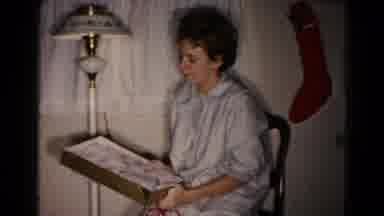 Hagerstown Maryland USA (1959): Brunette Girl In Pajamas Opens Christmas Presents