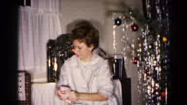 Hagerstown Maryland USA (1959): A Lady Sitting By Christmas Tree Wiping Down
