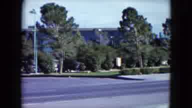 Nevada USA (1959): Blue Building With Parking Lot With Several Cars Surrounded By