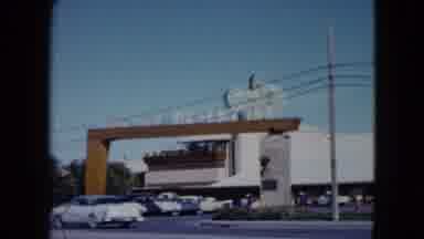 Nevada USA (1959): Cars Passing By Entrance Gate Of Desert Inn Where Cars Are