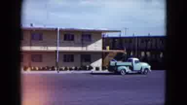 Nevada USA (1959): Street With Parked Green Truck In Front Of Two Story Tan