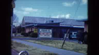 Nevada USA (1959): Passing View Of Ambassador Motel Sign On A Clear Day