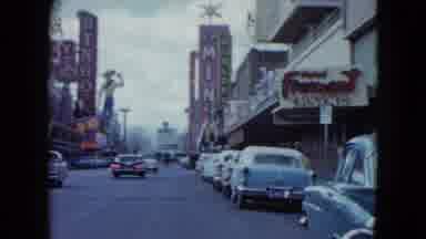 Nevada USA (1959): Driving Down A Busy Street Passing By A Golden Nugget Sign
