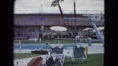 Nevada USA (1959): Large Blue Swimming Pool Under A Partly Cloudy Sky With Beige
