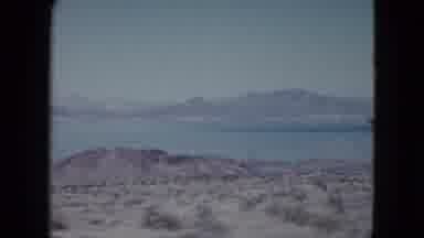 Nevada USA (1959): A Panoramic View Of A Body Of Water Topped With Mountains