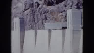 Nevada USA (1959): A Big Gray Concrete Wall Attached To A Mountain In The Day Time