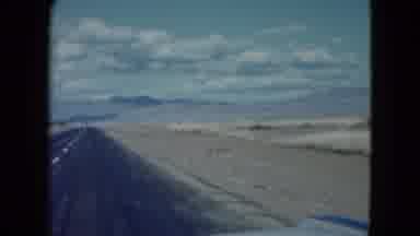 Nevada USA (1959): A Man Is Travelling In The Car On The Road To Enjoy Their