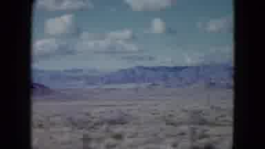 Nevada USA (1959): A Journey Under The Blue Sky And White Clouds In A Dry Valley