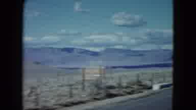 Nevada USA (1959): Scenic View Of An Open Field With Mountains In The Distance As