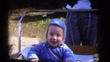 Camden New Jersey (1960): Baby In Blue Jacket Sitting In Stroller Smiling Outside