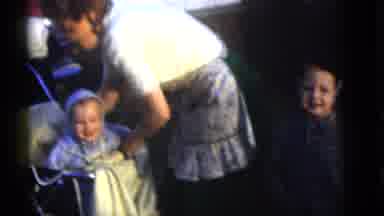 Camden New Jersey (1960): Woman Wearing White Shirt Wraps Baby Wearing Blue Coat