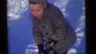 Camden New Jersey (1960): Child Wearing Grey Coat Falls In Snow On A Bright Sunny