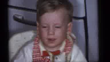 Camden New Jersey (1960): Boy Playing Toy Child Young Happy Sitting Human Bow Red