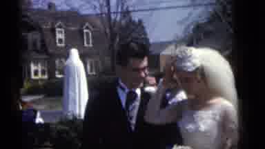 Camden New Jersey (1960): A Groom Talks To His Bride While Others Stand Around