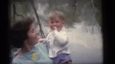 Camden New Jersey (1960): Woman Carrying Blonde Toddler Both Smiling While Posing
