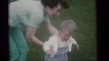Camden New Jersey (1960): Woman Wearing Green Pants And Shirt Sets Baby Wearing