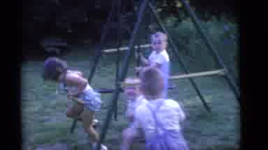 Camden New Jersey (1960): Kids Play On A Backyard Swingset On A Clear Day
