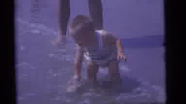 Camden New Jersey (1960): A Boy Is Playing In Water Near Beach Side