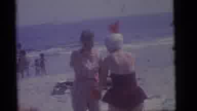 Camden New Jersey (1960): Two Young Men In Bathing Suits Playing In The Beach Sand
