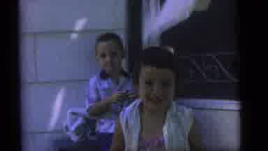 Camden New Jersey (1960): Two Kids A Boy And A Girl Sit By A Porch With A Screen