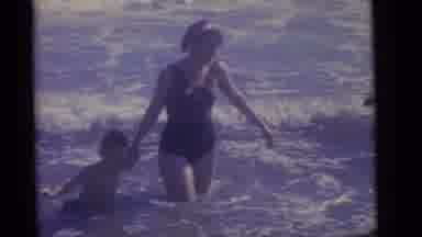 Camden New Jersey (1960): A Small Boy Is Playing With His Mother In The Beach In