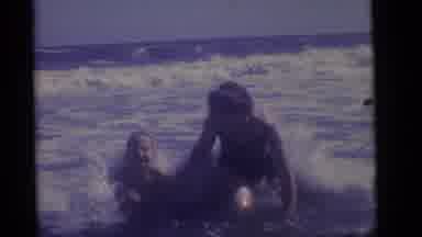 Camden New Jersey (1960): Woman And Child Walking Through The Waves At The Beach