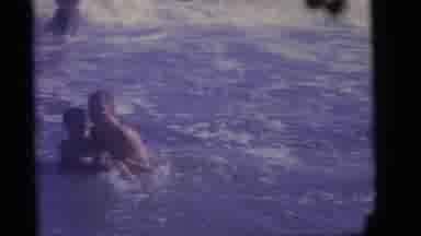 Camden New Jersey (1960): A Father Holding Son In The Surf Teaching Him How To